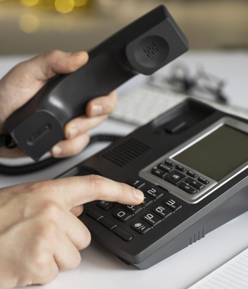 close-up-businessman-dialling-phone-number